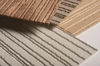 Artstone | Volkorn mineral-based wall panel samples with ribbed raw stone texture in neutral and earthy tones